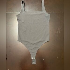 Grey body suit
